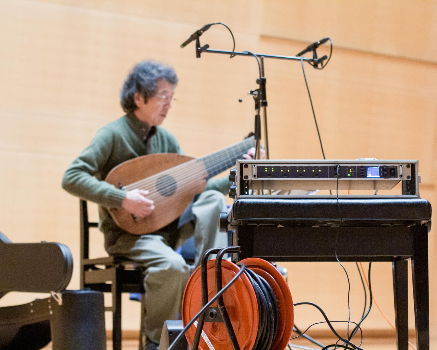 Toyohiko Satoh playing his lute at the recording sessions for his album "Reusner - lute music" in the Kirishima concert hall, Japan. RME OctamicXTC microphone amplifier in the foreground.