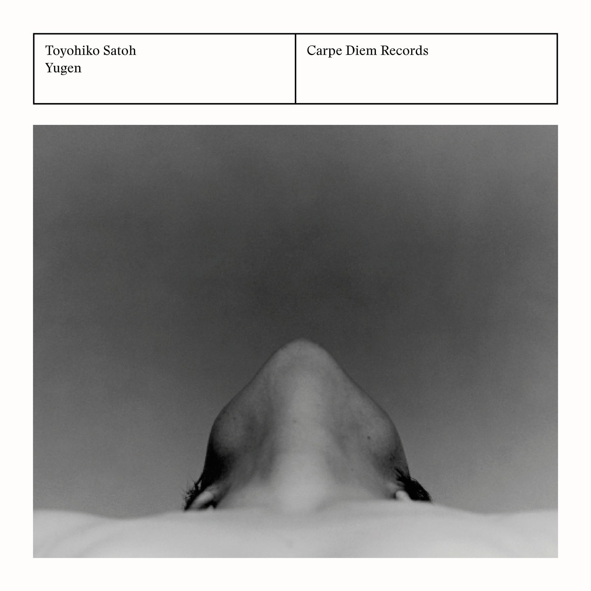 Back cover of the album "Yugen" by Toyohiko Satoh, Walter van Hauwe and Chiyomi Yamada featuring a monochrome portrait of a person from below.
