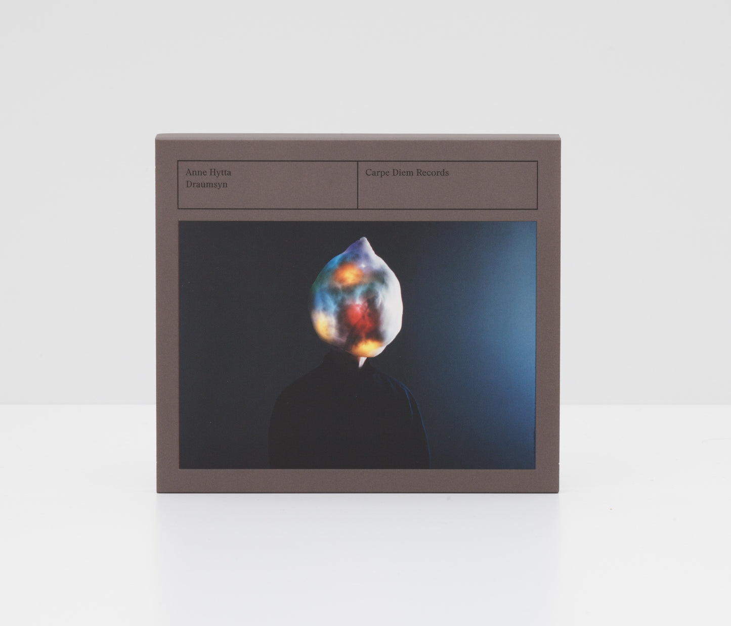 Physical CD Draumsyn by Anne Hytta, hardingfele, showing a person with a colorful glowing head.