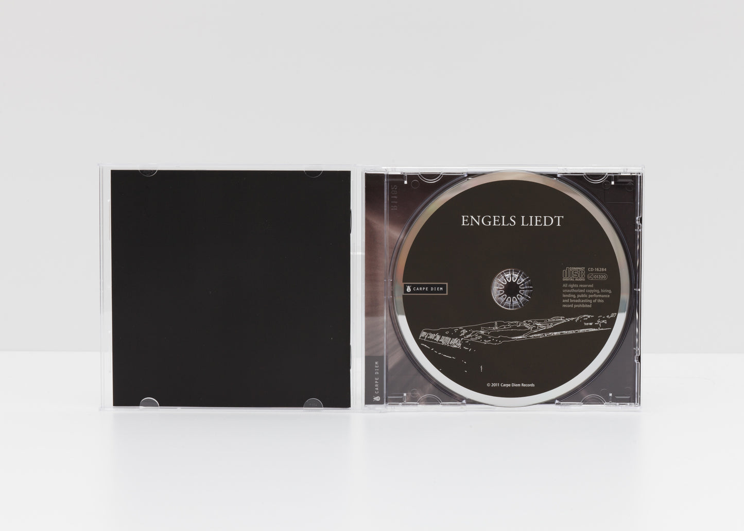 Jewelcase detail of the album "Engels Liedt" by Gerald Stempfel showing the CD. 