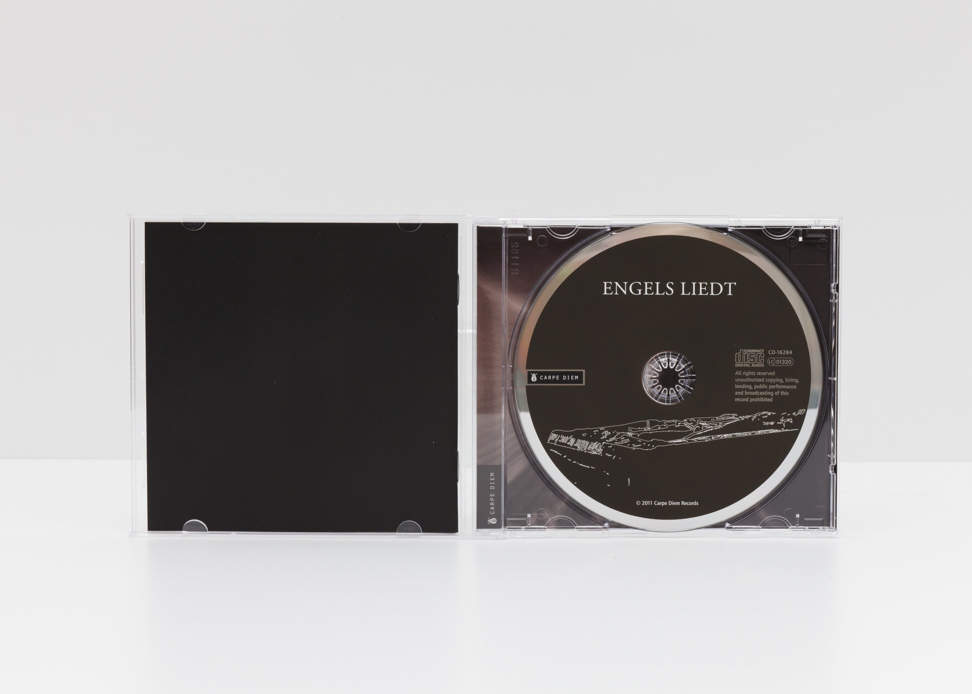 Jewelcase detail of the album "Engels Liedt" by Gerald Stempfel showing the CD. 