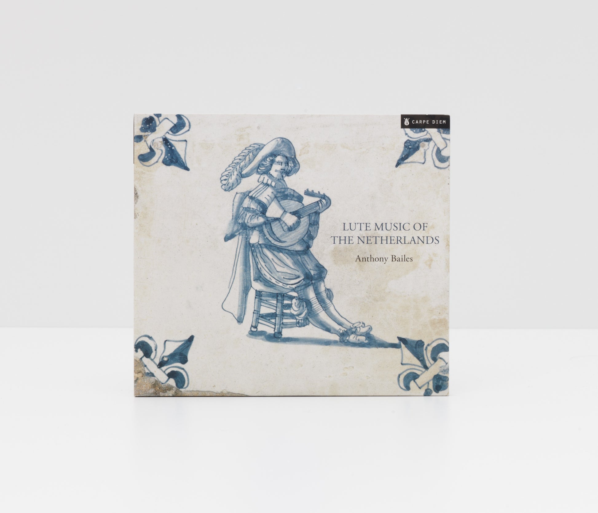 Digipack album cover of "Lute music of the Netherlands" by Anthony Bailes showing an antique Dutch ceramic tile with a picture of a lutenist