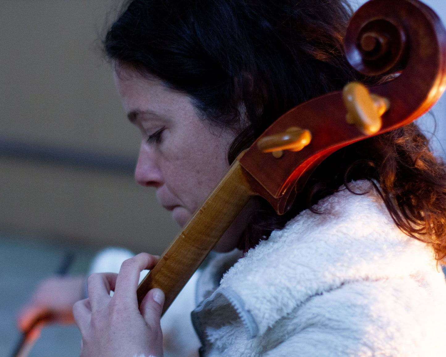 Closeup of Gyöngy Erödi playing her baroque cello at the recording sessions of her album "J. S. Bach Cello Suites I, II, V" in the powerful octagonal Kalvarienbergkapelle in Waldburg, Austria.