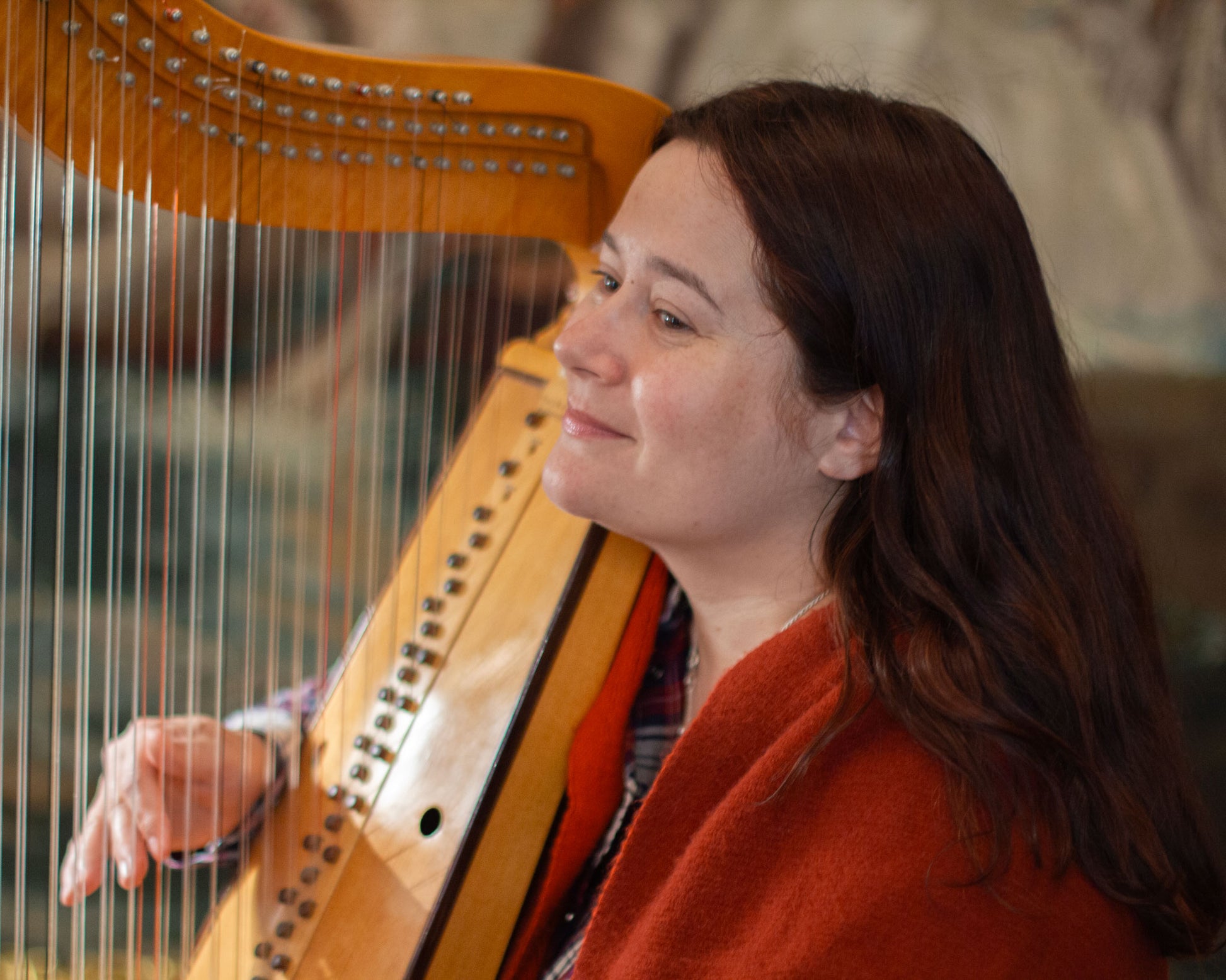 Arianna Savall playing a harp at the recording sessions of the Hirundo Maris album "The Wind Rose" for Carpe Diem Records