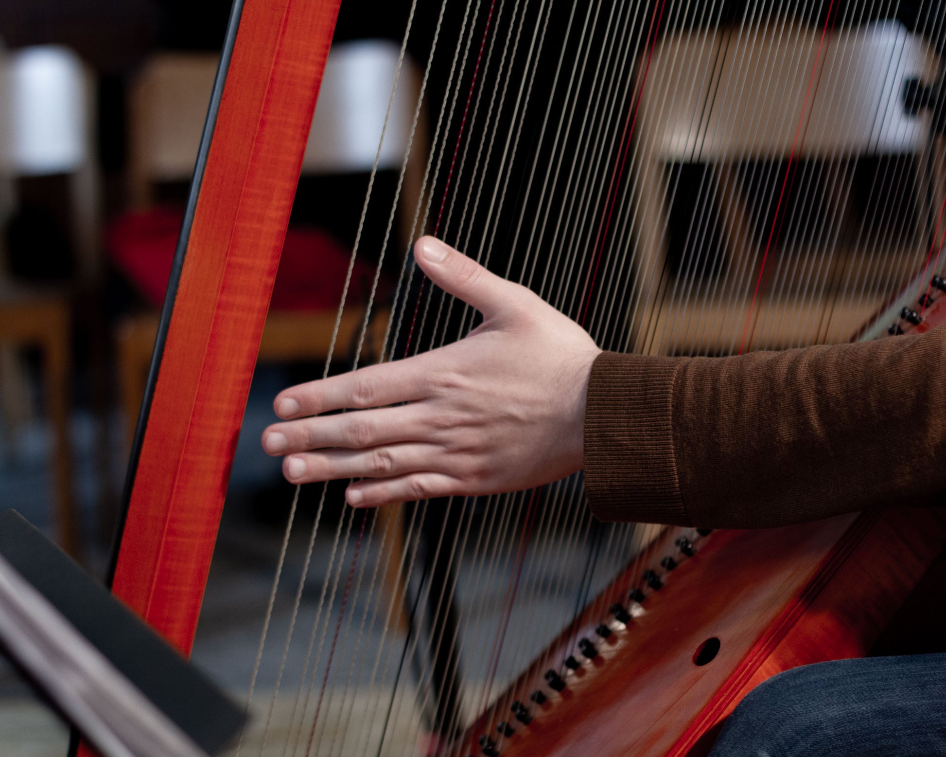 Detail of Maximilian Ehrhardt playing a Welsh triple harp at the recording sessions for his album "None but the brave" in the Andreaskirche Berlin-Wannsee in 2019. 