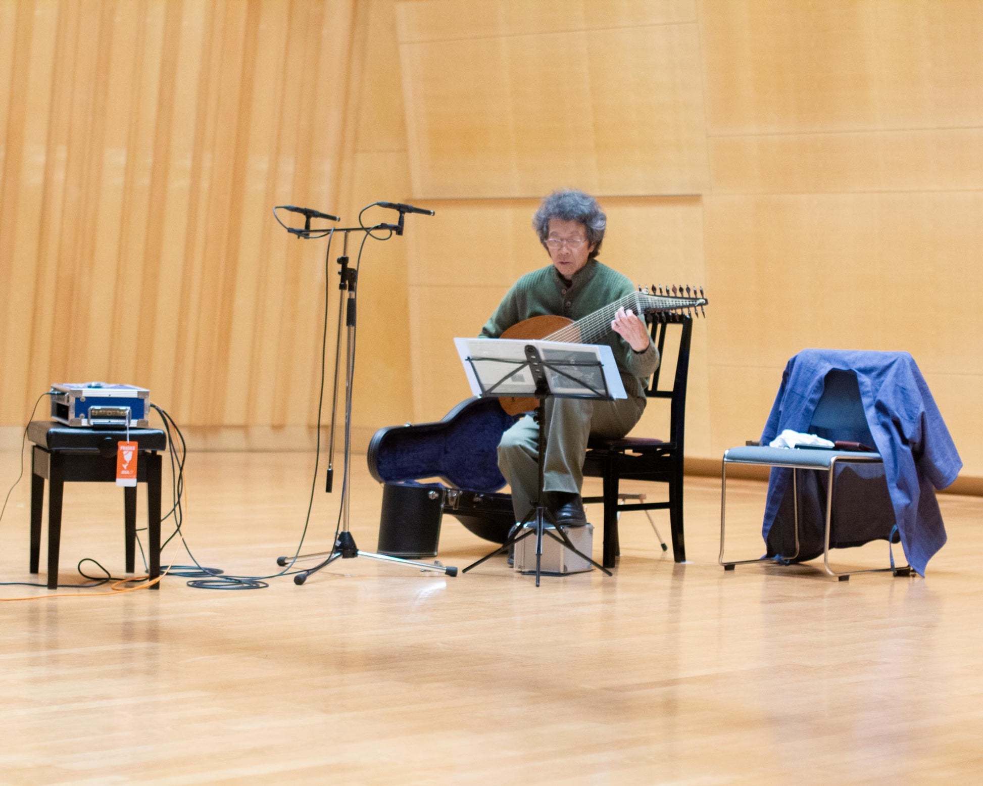 Toyohiko Satoh playing his lute at the recording sessions for his album "Reusner - lute music" in the Kirishima concert hall, Japan. 