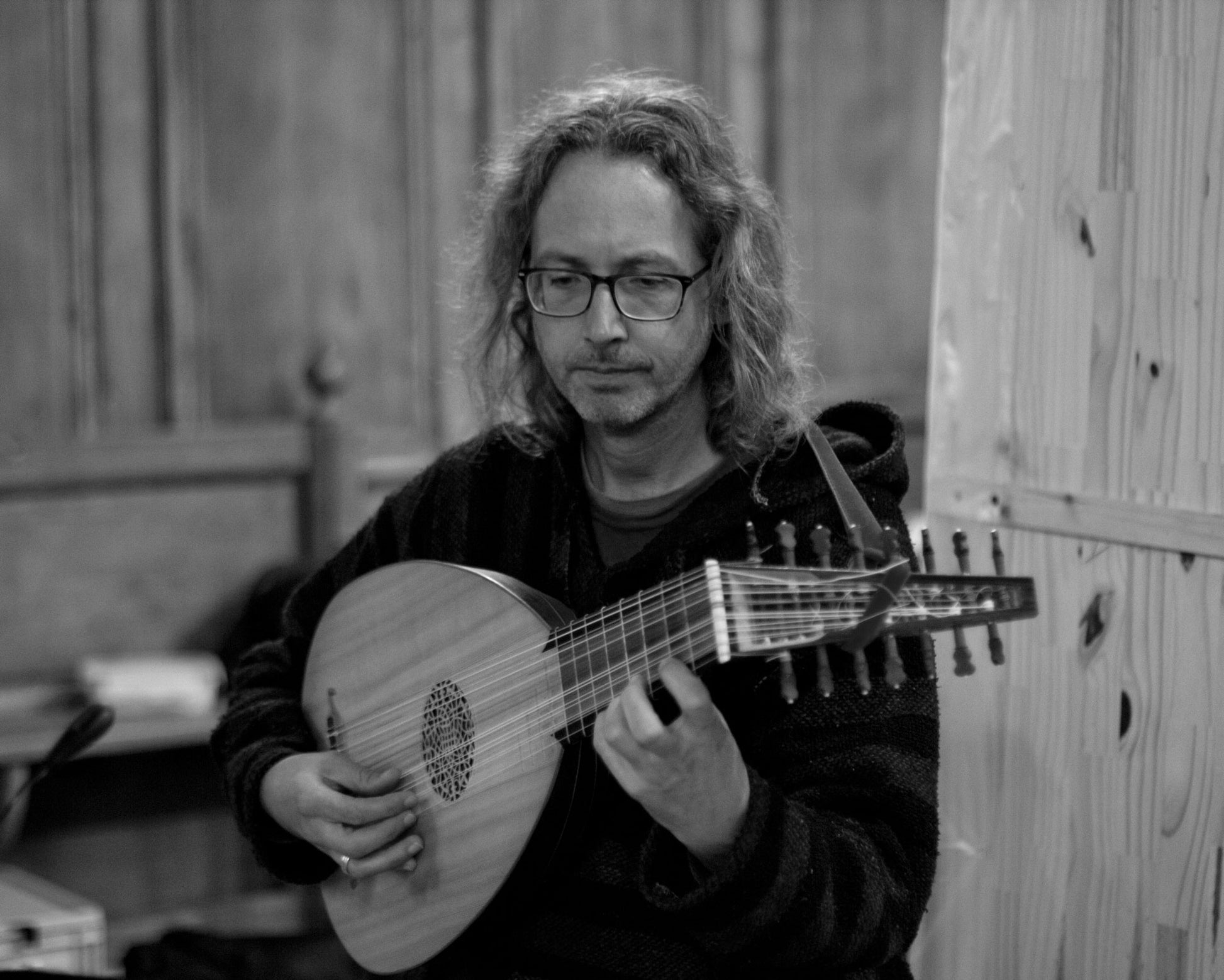 Florent Marie playing a lute for the recording of his album "Terzi - lute music" in a church in Normandy, France. 