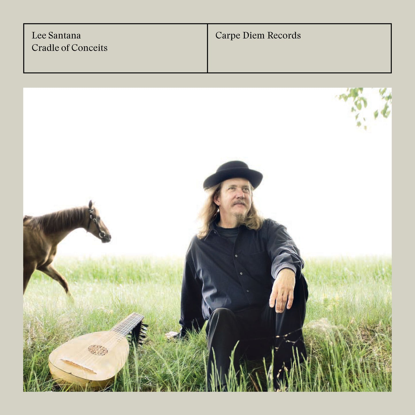 Album cover of "Cradle of Conceits" by Lee Santana, showing the artist sitting in the grass with a lute and a horse. 