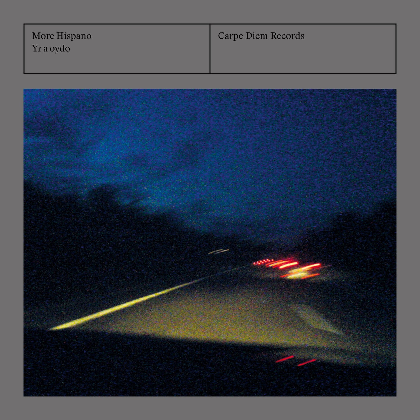 Album cover of "Yr a oydo" by More Hispano (Vicente Parrilla) & Raquel Andueza, showing gloomy car lights on a highway at night
